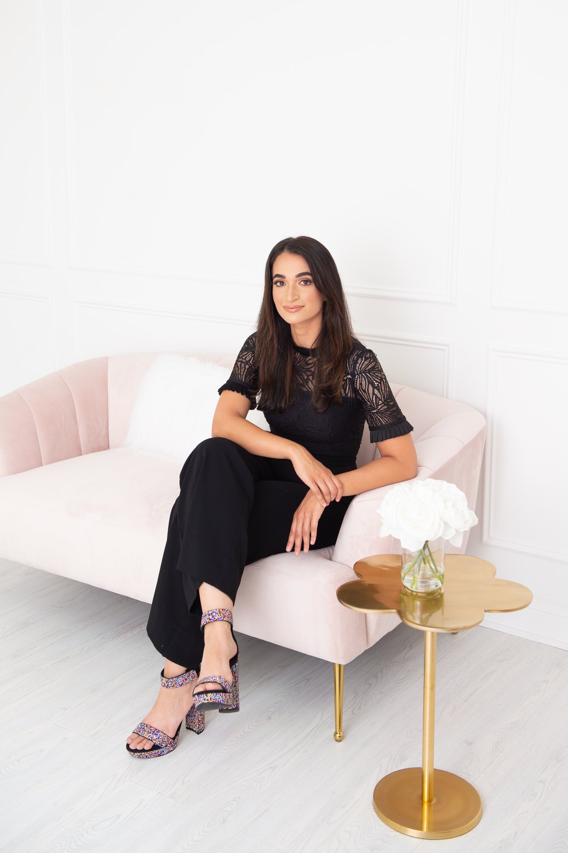 Salwa Qadir in a relaxed seated portrait