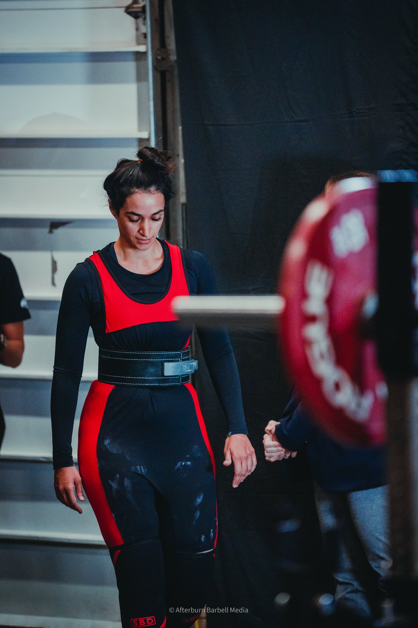 Salwa Qadir preparing to lift at a powerlifting competition